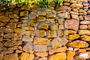 Old wall of round stones