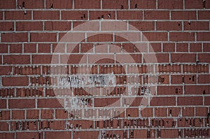 A old wall of stone bricks and a ground covered with snow
