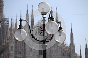 Old wall street lighting, in the old town, Milan, Italy