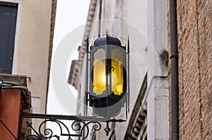 Old wall street lighting, in the old town, Venice, Italy