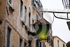 Old wall street lighting, in the old town, Venice, Italy