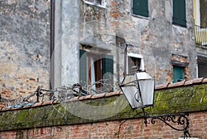 Old wall street lighting, in the old town, Venice, Italy