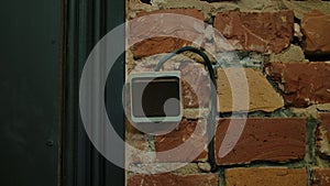 Old Wall Switch on Exposed Brick Background in Vintage Setting
