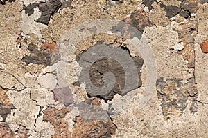 Old wall of a town house formed by different construction materials