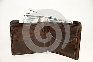 Old wallet with banknotes of US dollars inside