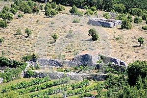 Old walls in the ancient town Lubenice, island Cres,  Croatia