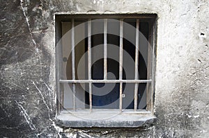 Old walls, rusty iron barred window