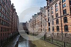 Old warehouses next to a canal in HafenCity, Hamburg, Germany