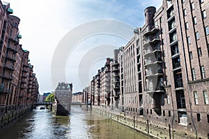 Old warehouses next to a canal in HafenCity, Hamburg, Germany