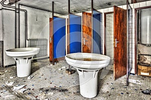 Old washroom with collective sinks and showers in an abandoned f