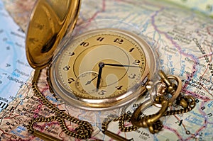 Old watch on map