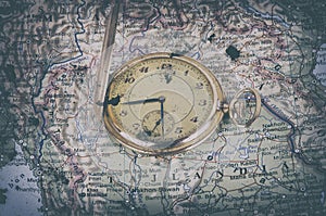 Old watch on map