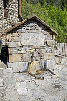 Old water fountain next to the church of San Cristobal, Beget Spain catalonia