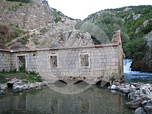 Old water mill on the river Ruda near the town of Sinj photo