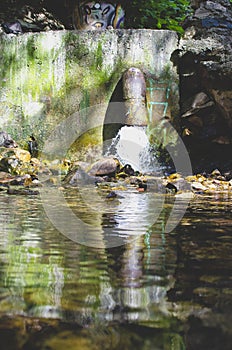 A old water pipe draining in the creek