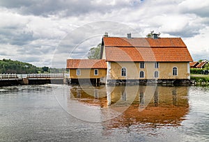 Old water power plant on a dam on a river