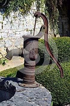 Old water pump in metal.