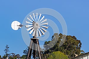 Old water pumping windmill, California