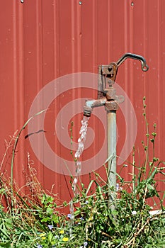 Old water spigot with running water