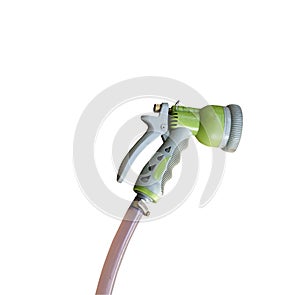 Old water spray gun and hose isolated on white background
