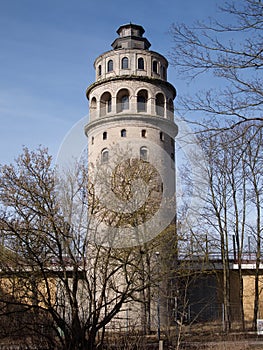 Old water storage tower with arched windows