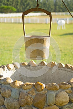 Old Water Well With Pulley and Bucket.