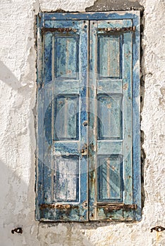 Old waterfront house shutter Mykonos Town Greece photo