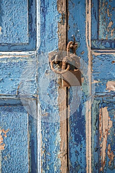 Old waterfront house window and padlock Mykonos Town Greece photo