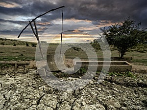 Old watering place for cattle with drinking trough