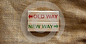 Old way vs new way, improvement and change management business concept. Wooden blocks on beautiful canvas background