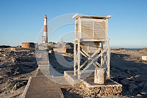 Old weather box by lighthouse