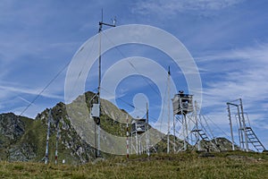Old weather station in the top of the mountains. against cloudy sky