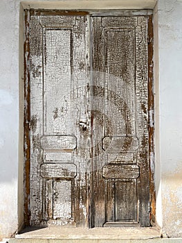 Old weathered antique door as a vintage background.