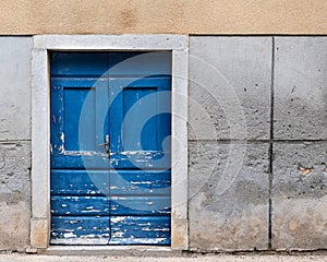 Old weathered blue door made of wood in Croatia