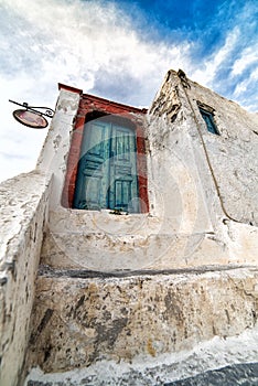 Old weathered blue door in Oia, Santorini, Cyclades, Greece