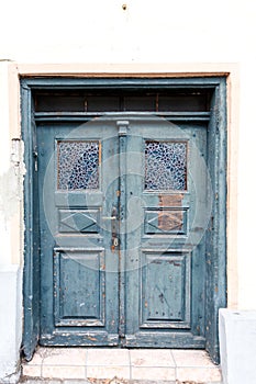 Old weathered blue wooden double door