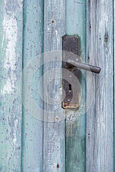 Old weathered blue wooden industrial door