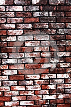 Old and weathered brick wall in white and red