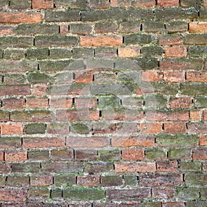 Old weathered and broken brick wall