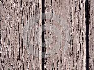 Old weathered chipped texture of painted wood as a grunge background. An old wooden background of weathered, battered rustic wood