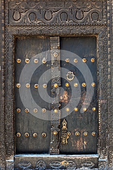 Old weathered door of building in Stone Town, Zanzibar