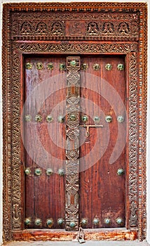 Old weathered door of building in Stone Town, Zanzibar