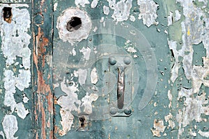 Old weathered door with peeling paint