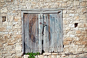 Old weathered door in a stone wall. Cyprus