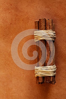 Old weathered leather background with cinnamon