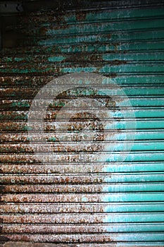 Old and weathered metal roller shutter