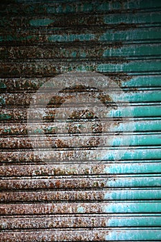 Old and weathered metal roller shutter