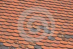 Old weathered red brown ceramic roof tiles