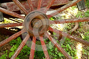 Old weathered red wagon wheel