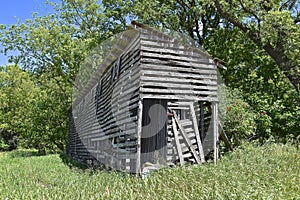 Old weathered rickety corn crib remains standing